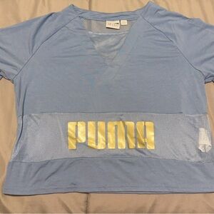 Blue and Gold Puma shirt with mesh top, never worn, perfect condition. Size XS